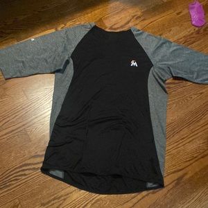 Majestic 3/4 sleeve insulated shirt with zipper pocket on the right side.